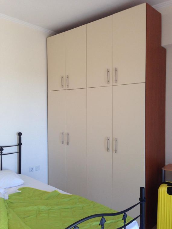 A bedroom and its full-height wardrobes