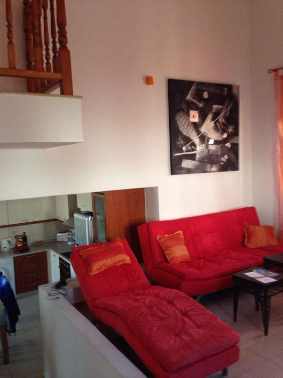 The sofas beside the staircase