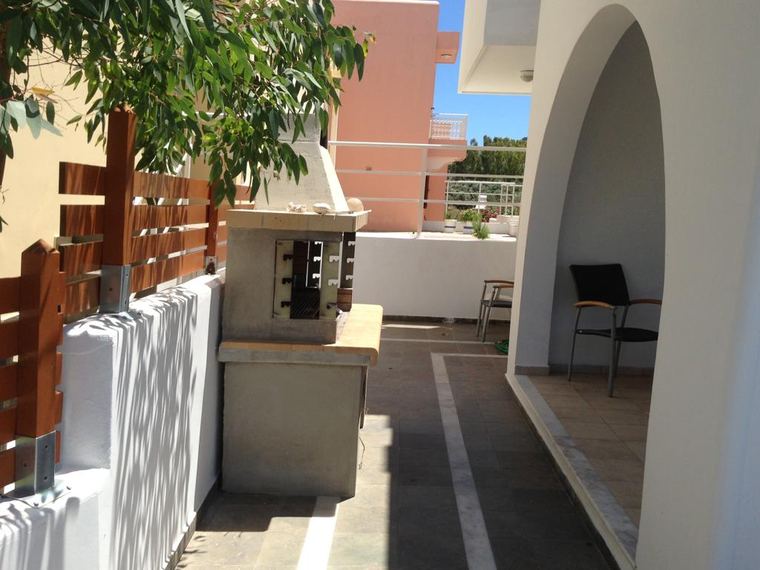 The stone-built barbecue and its outdoor kitchen